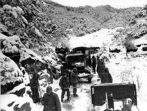 Picture - 2d Infantry Division elements move through a mountain pass south of Wonju, Korea, 1951.