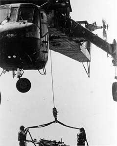 CH-54 SKYHOOK HELICOPTER DELIVERING 155-mm HOWITZER