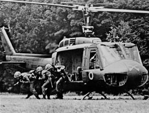 A BLUE TEAM RIFLE SQUAD FROM THE 1ST SQUADRON, 9TH CAVALRY EXITING FROM A HUEY