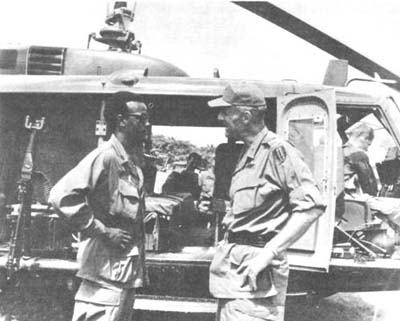 Photograph: General Rienzi Talks To Helicopter Crew Member In The Mek Ong Delta