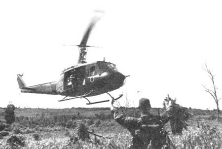 Photograph: Soldier Directs Landing Of Resupply Helicopter During La Drang Battle