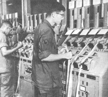 Photograph: Signalmen Transmitting Message At Manual Tape Relay Center