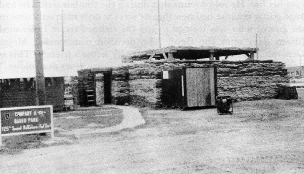 HIGH FREQUENCY RADIO BUNKER at 25th Infantry Division headquarters in Cu Chi. Antenna mast was made from artillery power canisters.