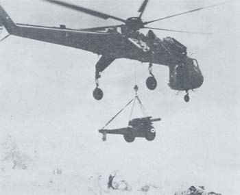 Photograph: CH-54 lifting 155-mm. Howitzer