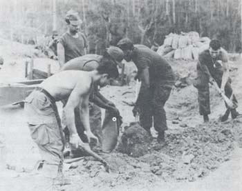 Photograph: Men from Battery A, 2d Battalion, 319th Field Artillery, building parapets