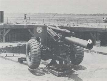 Photograph: 155-mm. howitzer position using Speedjack and Collimator