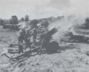 Photograph: 105-mm. Battery Firing from Hasty Position