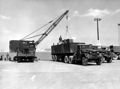Picture - Crane Loading Ammunition On To Transporter for Shipment to Ammunition Depot