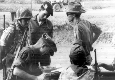 Photo: SCREENING CENTER IS ESTABLISHED WITH PHOTOGRAPHS AND BLACKLIST OF KNOWN VIET CONG. Each .suspect is brought to the center for preliminary interrogation.