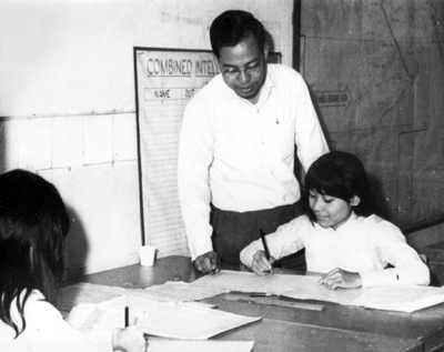 Photo: VIETNAMESE: CLERK IS TAUGHT PROCEDURES FOR COMPLETING AUTOMATIC DATA PROCESSING SYSTEM FORMS.
