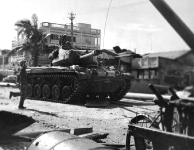 PICTURE -M41 OF SOUTH VIETNAMESE ARMY ADVANCES ON ENEMY POSITIONS IN SAIGON, MAY 1960