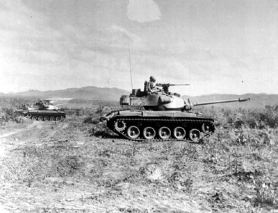 PICTURE - M41 IN SOUTH VIETNAMESE TRAINING OPERATION. Tank has 76-mm. gun, light armor, two machine guns, and crew of four.