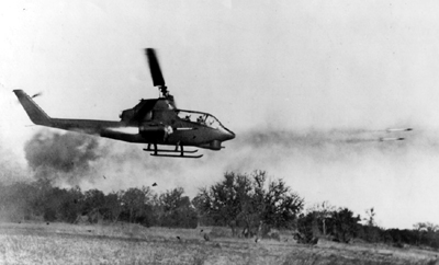 PICTURE : Huey Cobra Firing Rockets at Enemy Target
