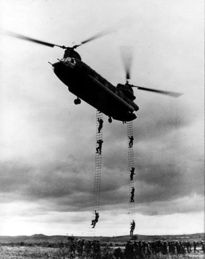 PICTURE: Solldiers Training on Troop Ladders Suspend From CH-47. The  Troop Ladder Was Superior to the Rappel Rope Because it Could be used for Recovery as Well as Insertion.