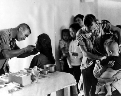 PICTURE: Villagers From Refugee Camp in Bien Hoa Province Receive Treatment During a MEDCAP