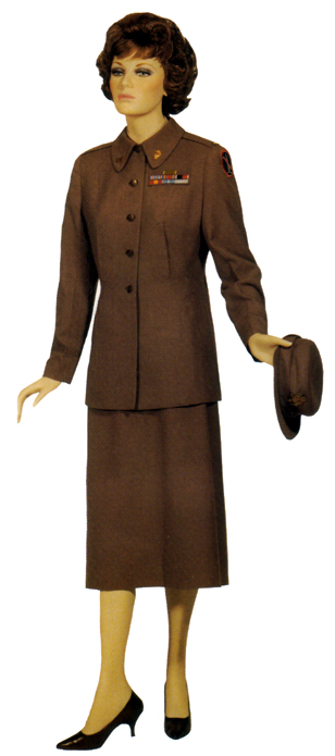 Plate 17. Officer in the year-round, wool taupe service uniform (1951-1960), worn with tan shirtwaist, cafe brown oxfords or pumps, and matching service hat. This uniform was also worn by enlisted women.