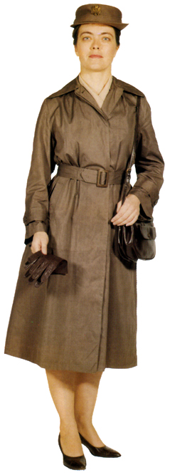 Plate 21. Officer in the taupe raincoat (1951-1966), a nylon-rayon cloth. This raincoat, also worn by enlisted women, had a removable hood and was worn with the button-in liner from the overcoat. If a scarf were worn, the coat could be unbuttoned to the second button. It was worn with cafe brown leather purse and gloves or, in summer, the tan cotton gloves.