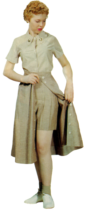 Plate 22. Enlisted woman in the taupe three-piece exercise suit (1951-1971), consisting of a cotton chambray shirt and denim cloth skirt and shorts. Later blue, it was worn with white tennis shoes and cotton taupe anklets for fatigue duties (KP, etc.), physical training, and sports activities. Officers also wore this uniform.