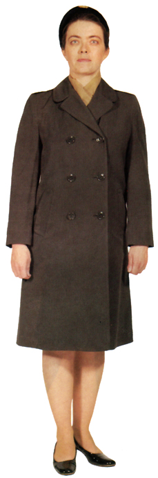 Plate 30. WAC officer in the women's green overcoat of wool gabardine with removable liner (1967-1985). The overcoat collar could be worn open or closed, with or without the gray-beige scarf. The overcoat was also worn by enlisted women.