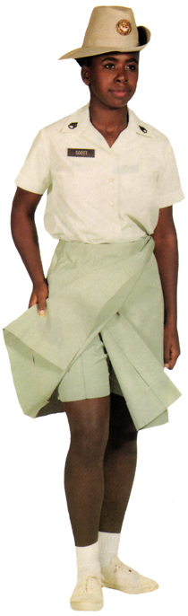Plate 35. Drill sergeant in the year-round training duty uniform (1971-1981), a light green cotton poplin shirt and darker green cotton shorts and skirt worn with a garrison cap or, as shown here, with the distinctive hat worn only by women trained to be drill sergeants. Upon certain occasions (instructing, etc.) women officers also wore the training duty uniform.