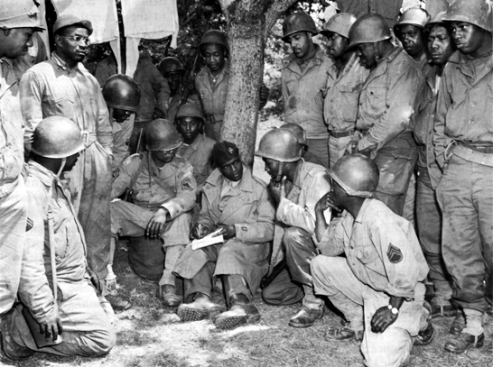 Photo: ANP CORRESPONDENT AND MEN OF A SIGNAL CONSTRUCTION BAT'TALION