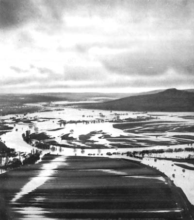 Photograph: Supply Roads Flooded By the Moselle, in rear of the 5th Infantry Division. Mousson Hill appears on the right.