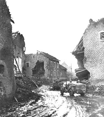 Photograph: Jeeps Driving Through Dieuze with troops of the 4th Armored Division on their way to the front.