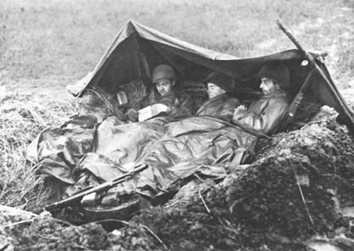 Photograph: Keeping Warm and Dry was a major problem as cold and rain increased the incidence of trench loot.