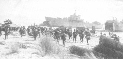Photo: LST's Bring In Trucks And Tanks