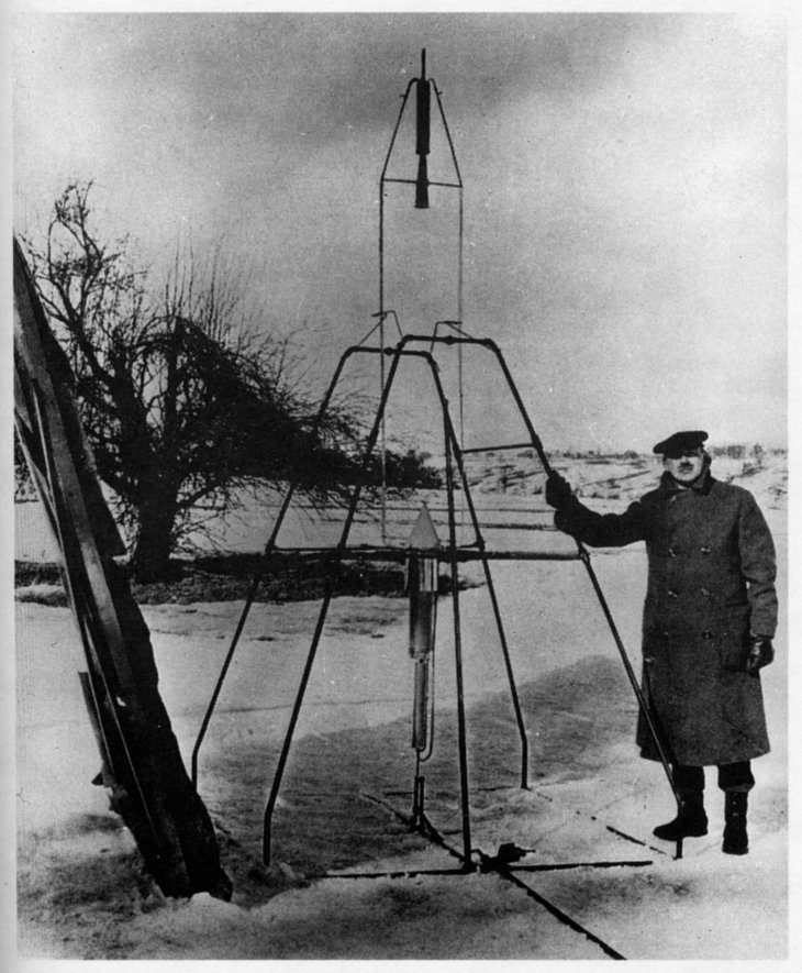 Scientist Robert Goddard pictured with early rocket