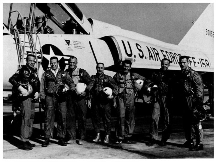 astronauts in flight gear posing in front of F-106