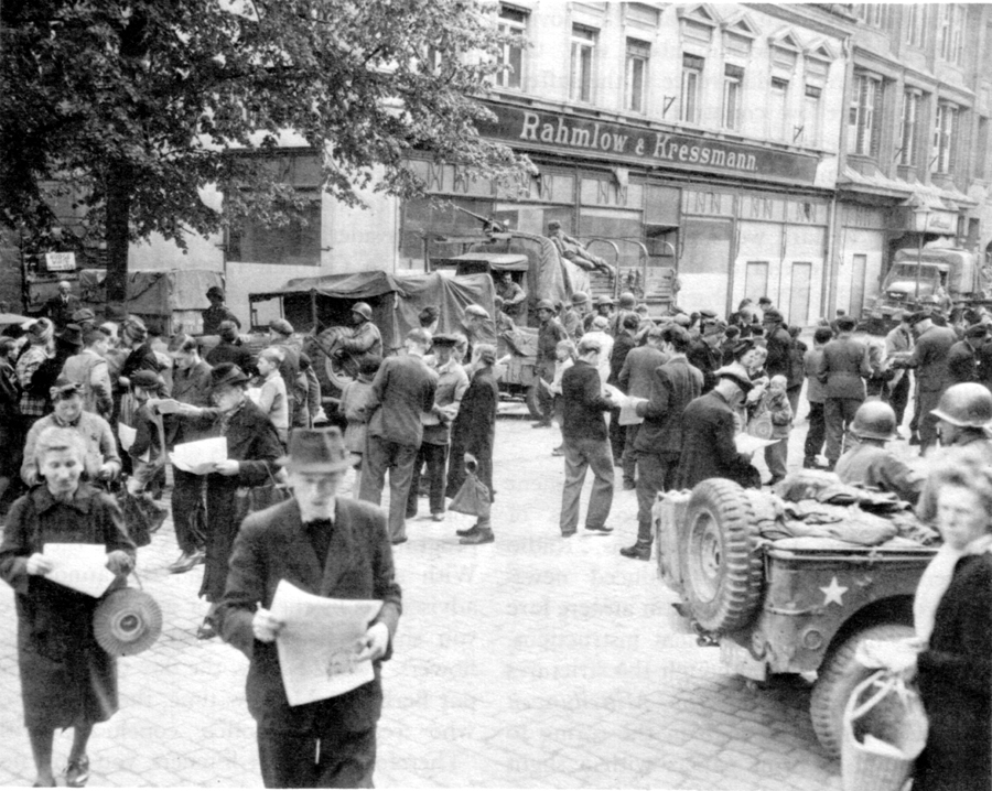 TROOPS DISTRIBUTE GERMAN-LANGUAGE NEWSPAPERS