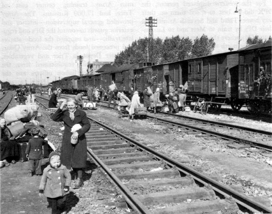 WESTBOUND DPs BOARD A TRAIN in the yards at Weimar.